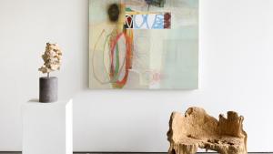 Michael Barringer Painting alongside organic objects from exhibit art gallery. 