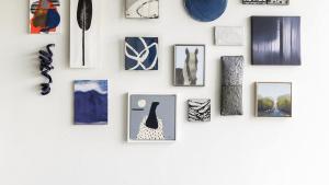 image of a salon style gallery wall with a blue theme