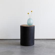 tribe stool with glass vase 