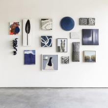 image of a salon style gallery wall with a blue theme 