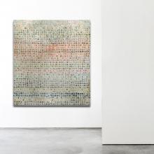 artwork in turquoise, orange, teals, and neutrals by Jennifer Wagner hanging on a gallery wall 