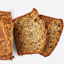A loaf with two slices cut of Earl Grey Yogurt Cake 