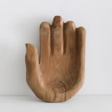 Cupped Hand Bowl Sculpture leaning against wall