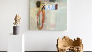 Michael Barringer Painting alongside organic objects from exhibit art gallery.